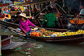 Thailand, Locals sell fruits, food and products at Damnoen Saduak floating market near Bangkok 